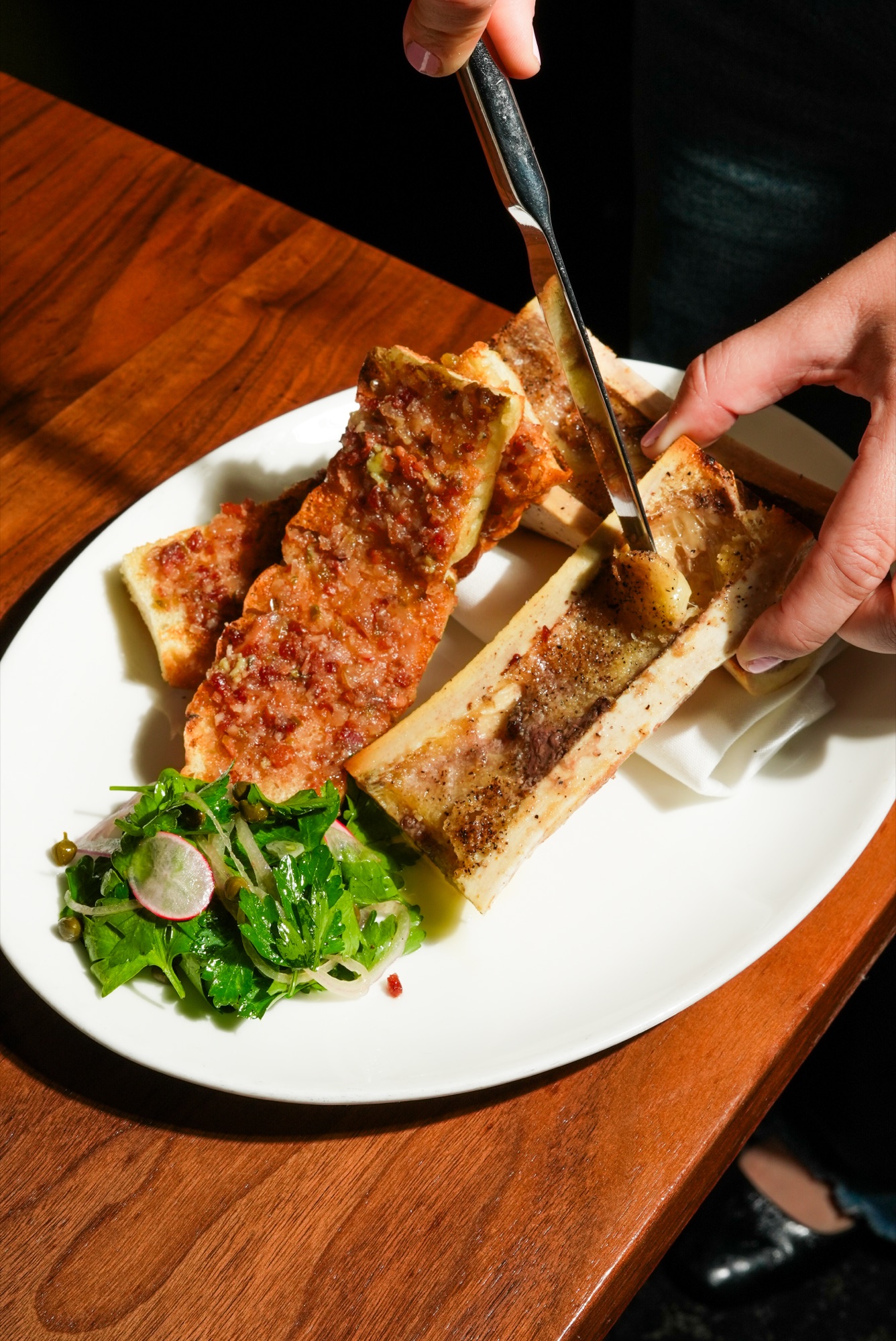 Roasted bone marrow with bacon-onion jam and grilled focaccia at The Arthur J
